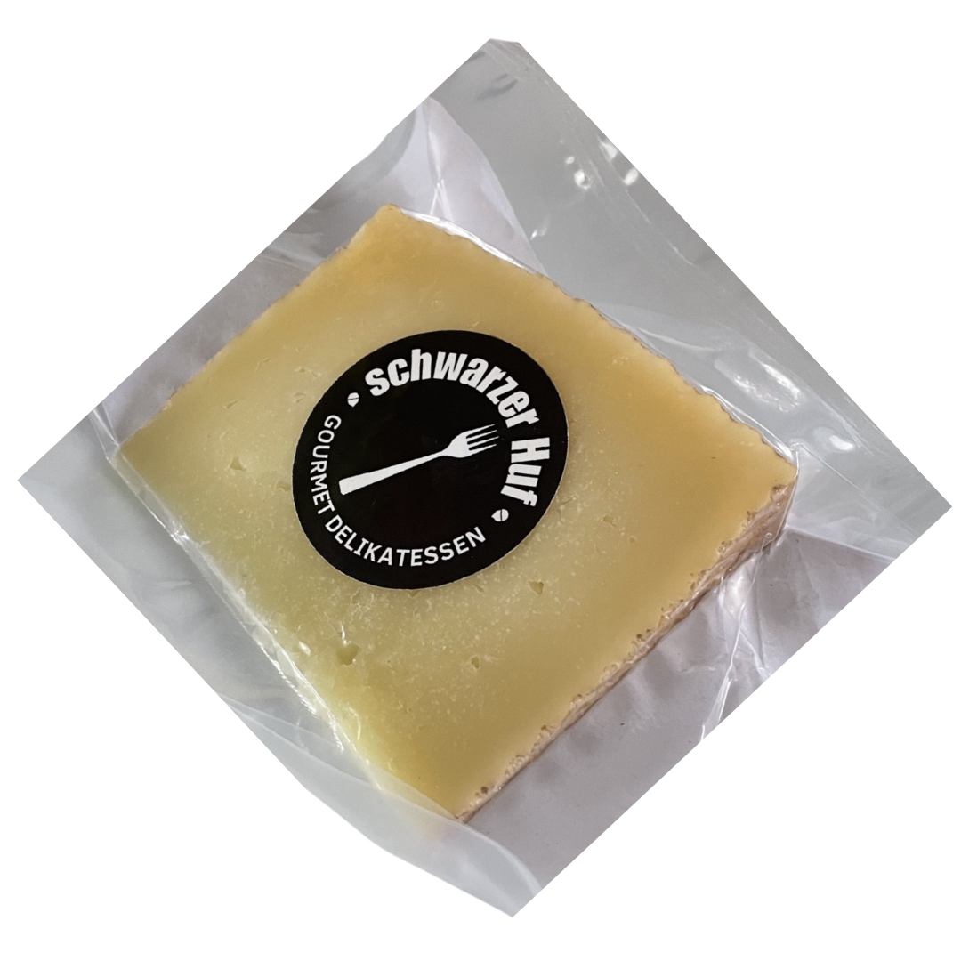 Vakuumverpackter gereifter spanischer Schafskäse mit fester Textur und intensivem Aroma, traditionelle Feinkost